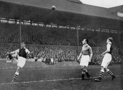 Acrobatics in an Arsenal v Chelsea match at Stamford Bridge, London, c1933-c1938 by Sport and General
