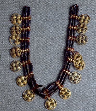 Sumerian Art: necklace with gold pendants and lapis lazuli beads used for the wedding. From the royal tombs of the site of Ur. 2600-2500 BC. National Iraq Museum Baghdad by Sumerian Sumerian