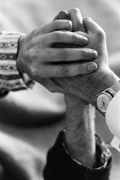 Hands of a patient and doctor during LSD treatment by Ted Spiegel