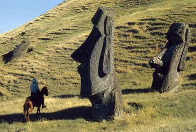 Easter Island monoliths called moai in a volcanic landscape are ancient sentinels by Thomas J. Abercrombie