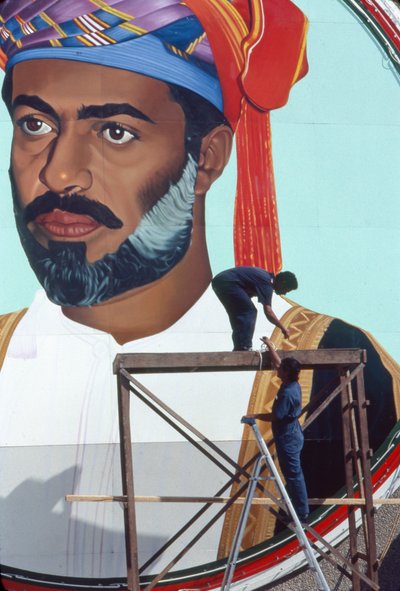 Workmen Maintain a Giant Mural of Qaboos bin Said Al Said, Sultan of Oman by Thomas J. Abercrombie