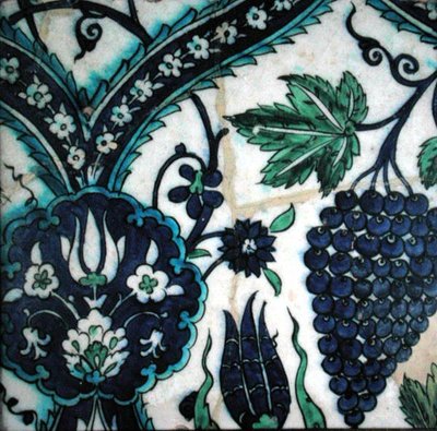 Isnik tile with flowers and a bunch of grapes by Turkish School