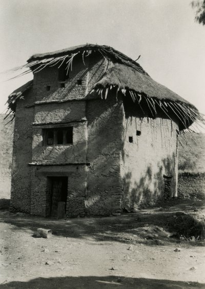 Square hut with thatched roof, Axum, Ethiopia by Ugo Monneret de Villard