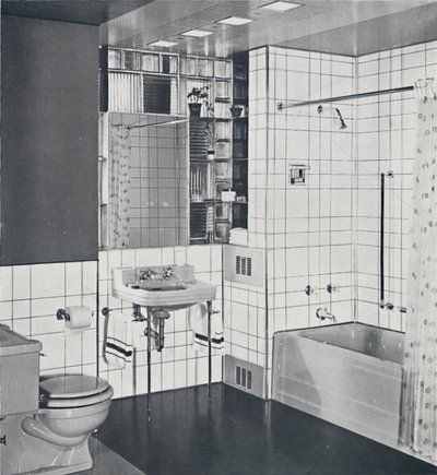 Crane Co. - A compact recess tiled in canary yellow, scored with orange, showing the stainless-steel by Unbekannt