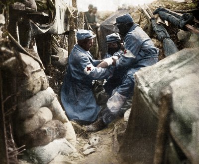 First Aid to a Wounded Man in One of the French Trenches, 1915 by Unbekannt