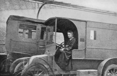 Marie Curie, Polish-born French Physicist, Driving a Car Converted into a Radiological Unit by Unbekannt