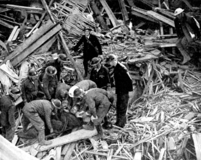Rescue Workers Releasing a Man from a Bomb Damaged Building, World War II, 1940 by Unbekannt