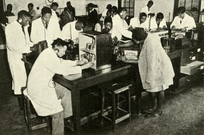 Scenes in a Native College - Students in the physics laboratory by Unbekannt