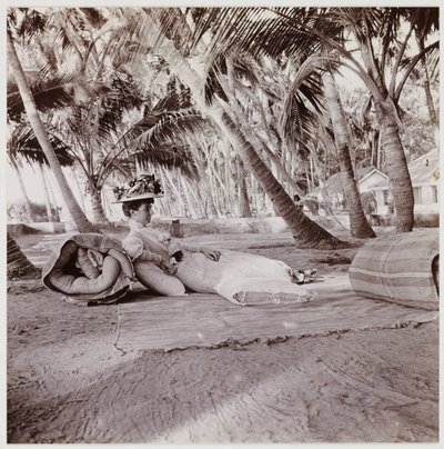 Woman lying beneath palm trees, c 1911 by Unbekannt