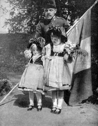 Young Alsatian children in traditional dress with a French soldier, World War I by Unbekannt