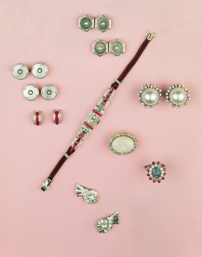 Selection of Art Deco jewellery; calibre cut ruby watch; button, cufflink and studs; earrings; Mabe pearl and diamond earrings by Unbekannt Unbekannt