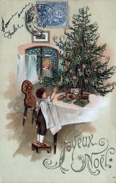 Christmas greeting card: a child in front of a Christmas tree poses on a table, observed by an angel in the window by Unbekannt