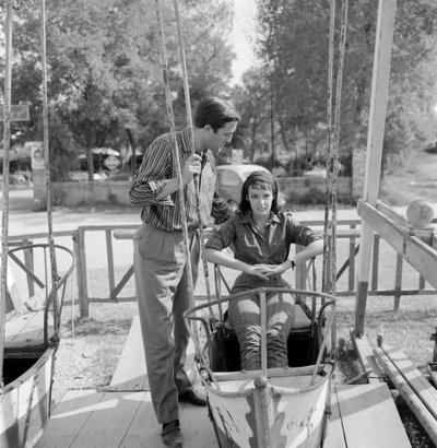 The Actress Marie Laforet with the Director Jean Gabriel Albicocco at Venice Lido - 1961 (on a swing) by Unbekannt