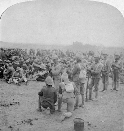 The Overpowered Boer Prisoners Resting on the Road from Paardeberg to Modder River, 1900 by Underwood and Underwood