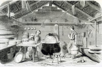 Making Gruyère cheese in a Swiss chalet, or cheese factory in the Alps - in 