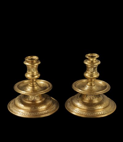 Pair of candlesticks of engraved brass, with later reworking, gilding and addition of removable sockets and wood bases, 1500-25 by Venetian School
