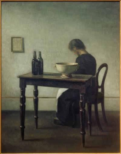 Woman Sitting Behind a Table by Vilhelm Hammershoi