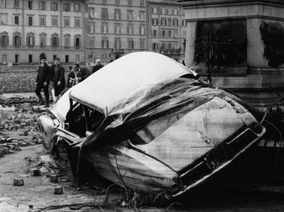 Citroen DS flung up against a monument during the flood of Florence, November 1966 by Vincenzo Balocchi