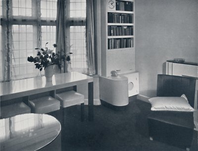 Renovart Ltd: A One-Room Flat with a Useful Corner Fitment Including an Electric Clock by W. Dennis Moss