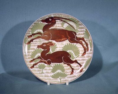 Plate decorated with two running antelope in ruby red lustre on cream-coloured earthenware, late 19th century by William de Morgan