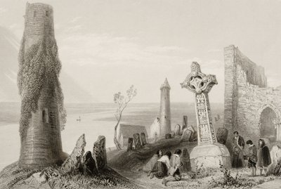 The Ancient Cross and Round Tower at Clonmacnois, County Offaly, Ireland, from 