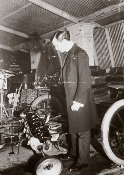 C. S. Rolls Looking at the Engine of a Motor Car in His Garage, c. 1900 by Ferdinand Georg Waldmuller