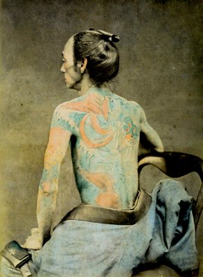 Japanese man with traditional Irezumi tattoos, c.1890 (hand coloured  albumen photo)