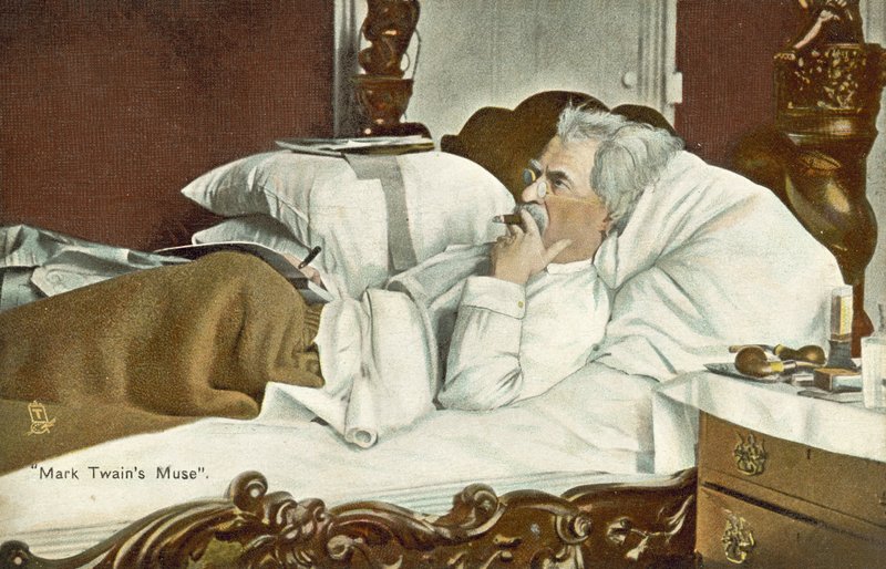 Mark Twain, lying in bed, smoking a cigar by American Photographer