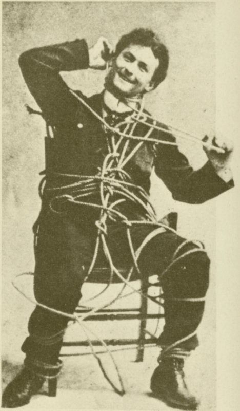 The young Harry Houdini doing an escape rope trick in 1898 by American Photographer