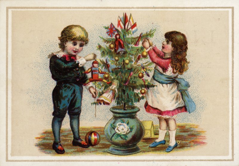 Children decorating a small Christmas tree by American School