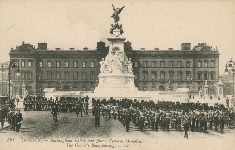 Buckingham Palace and Queen Victoria Memorial; The Guards Band passing by English Photographer