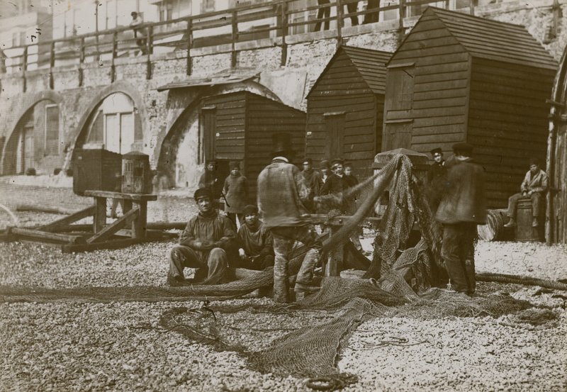 Fishermen with their nets on the beach in Brighton by English Photographer