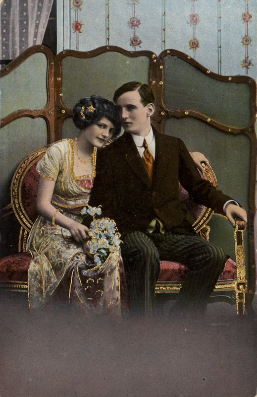 Man and woman with a bunch of flowers by English Photographer