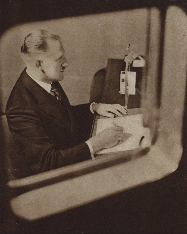 Newsreader Reading the News in the Studios of the BBC, London by English Photographer