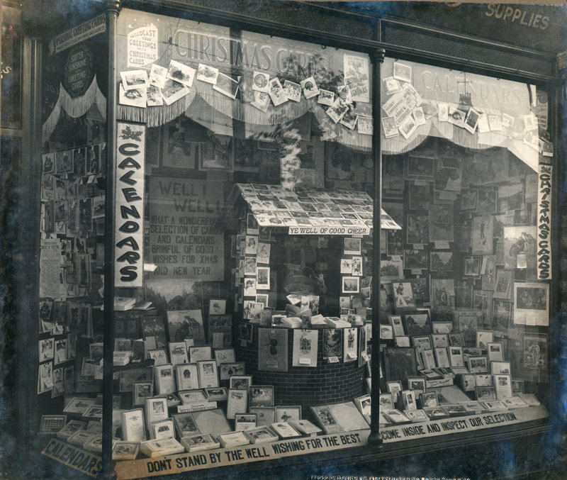 Shopfront displaying Christmas cards and calendars by English Photographer