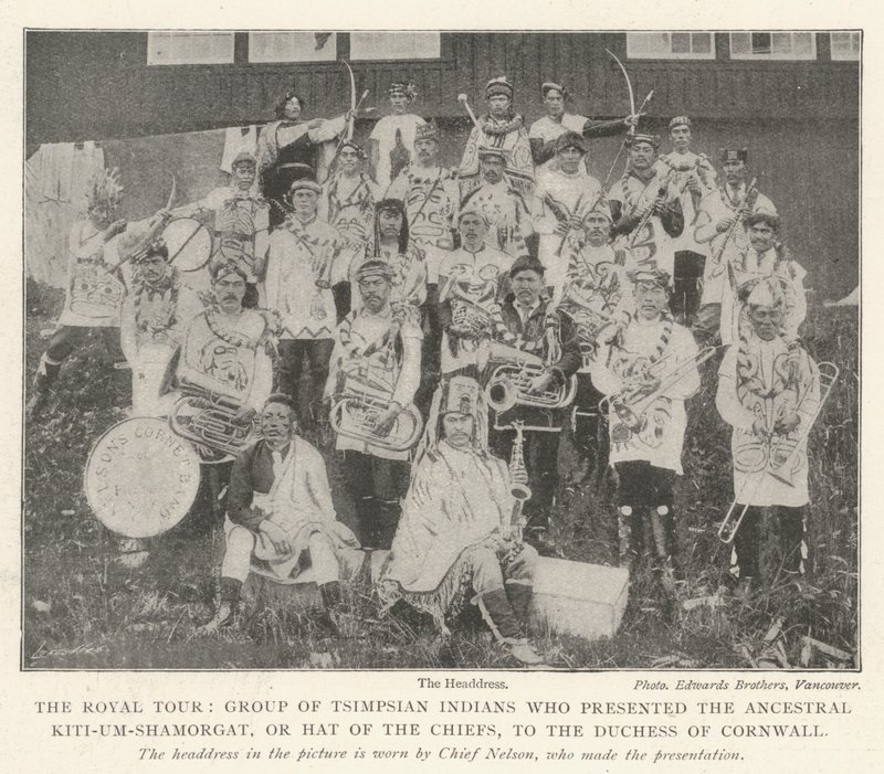 The Royal Tour, Group of Tsimpsian Indians who presented the Ancestral Kiti-um-Shamorgat, or Hat of the Chiefs, to the Duchess of Cornwall by English Photographer