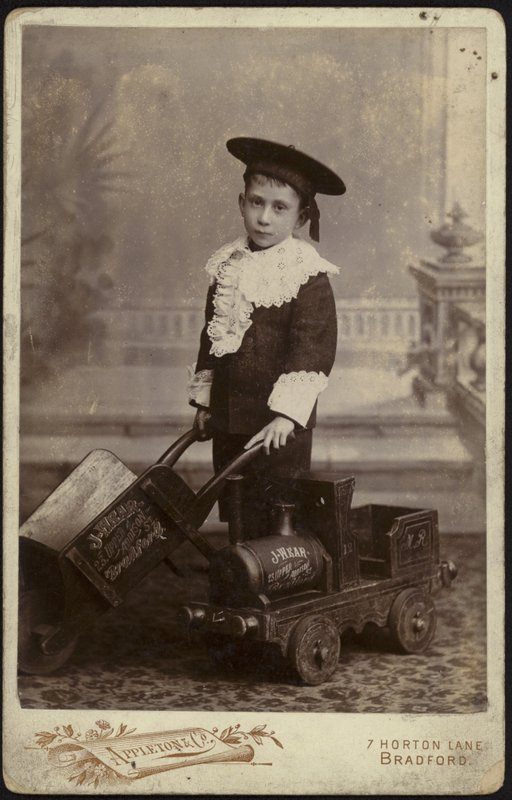 Portrait of a Young Boy Posing with a Handcart by English School