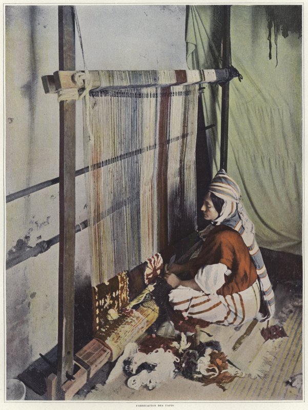 A Woman Weaving a Tapestry on a Loom in Tunisia by French Photographer