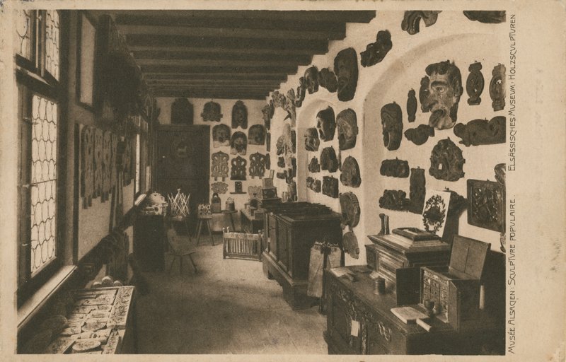Alsatian Museum with display of wooden sculptures. Postcard sent in 1913 by French Photographer