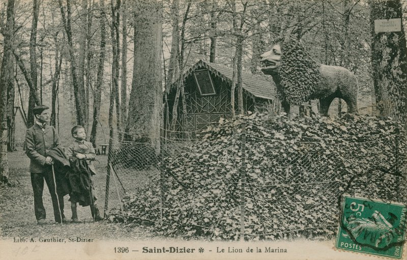 Father and son looking at lion sculpture in Saint Dizier. Published by the Library of A Gauthier by French Photographer