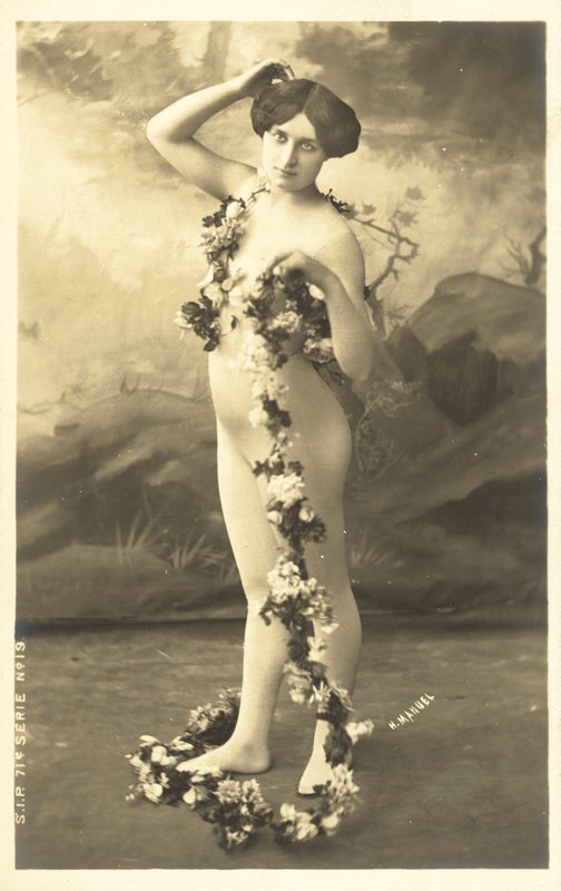 Girl in Body Stocking Holding Garland of Flowers by French Photographer