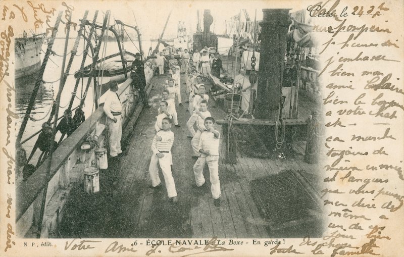 Trainee sailors at a French naval school having a boxing lesson on deck by French Photographer