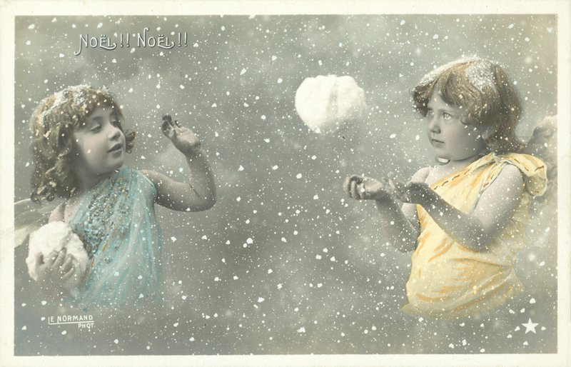 Two Girl Angels Throwing Snowballs at Each Other by French Photographer