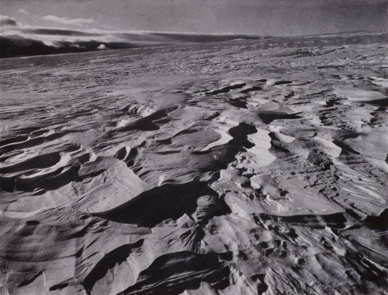The great waves of frozen snow thrown up by the wind by Herbert Ponting