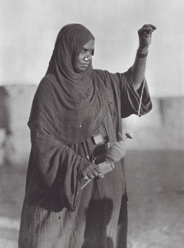 Africa: Bisharin Woman Spinning, Nubian Desert by Hugo Adolf Bernatzik
