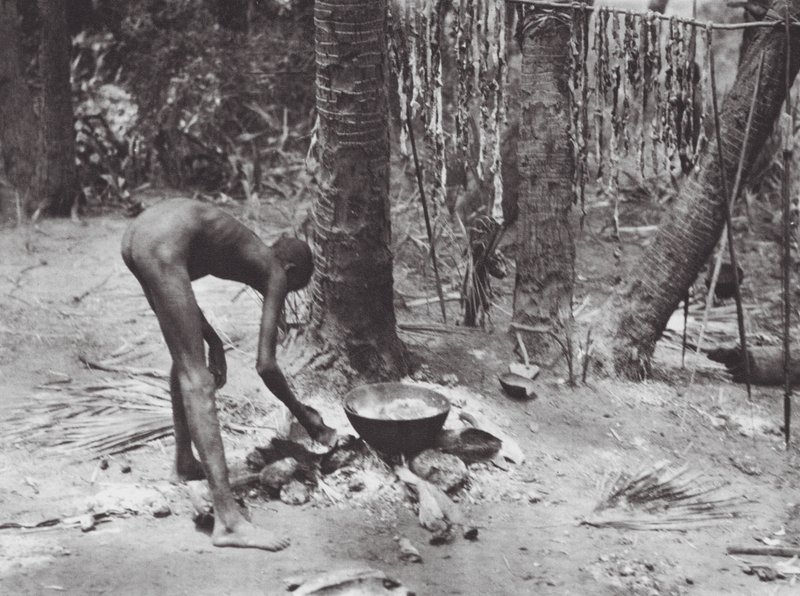 Africa: Nuer Cooking Crocodile Meat by Hugo Adolf Bernatzik