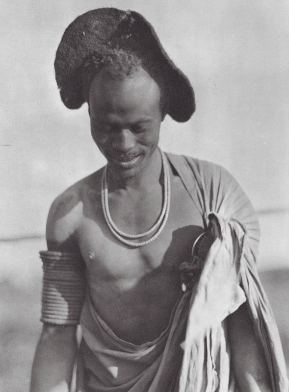 Africa: Shilluk warrior with hood coiffure by Hugo Adolf Bernatzik