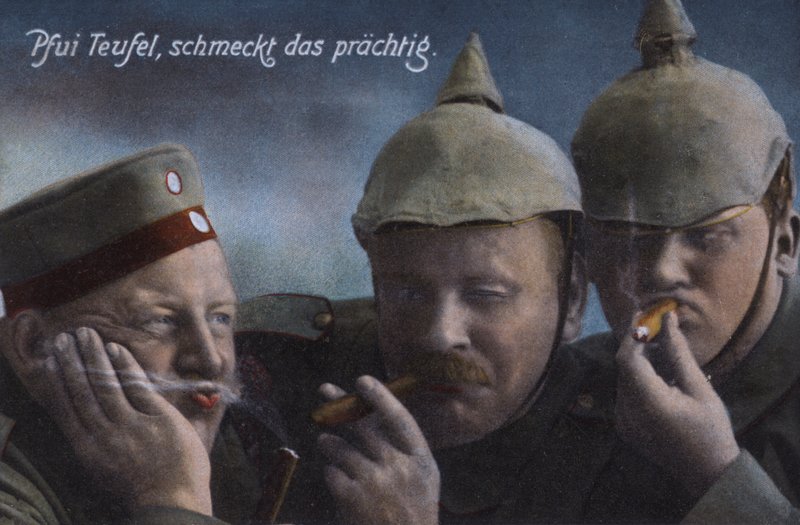 German soldiers enjoying cigars by Photographer German