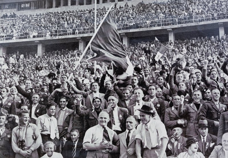 Italian fans supporting their athletes in the stadium at the Olympic Games, Berlin, Germany by Photographer German