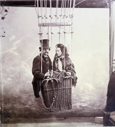 Photographic portrait of photographer and aerostat pilot Felix Tournachon dit Nadar and his wife posing in a balloon basket